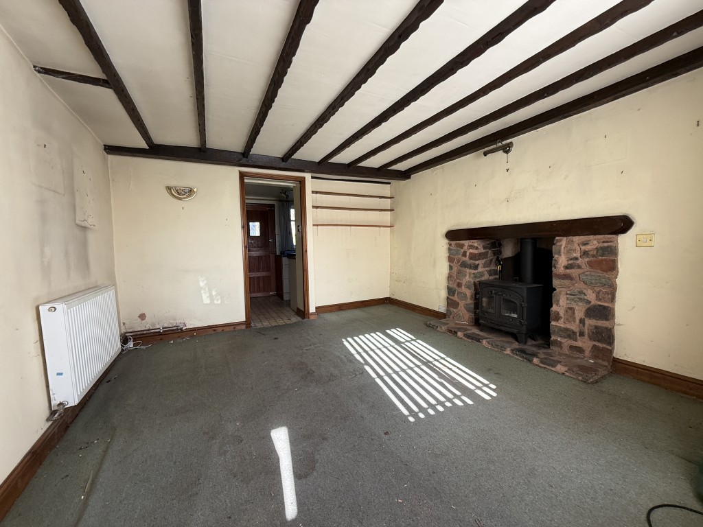 Lot: 26 - TWO-BEDROOM COTTAGE FOR IMPROVEMENT IN POPULAR DEVON VILLAGE - Sitting Room